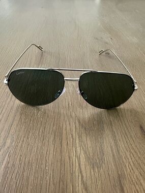 Cartier Silver Frame Sunglasses with Dark Green Lenses CT0110S004